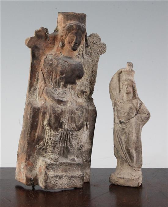 A Greek terracotta seated figure of a deity, probably Hera and another standing figure of a lady, c.4th century BC, 22.5cm and 16cm, fa